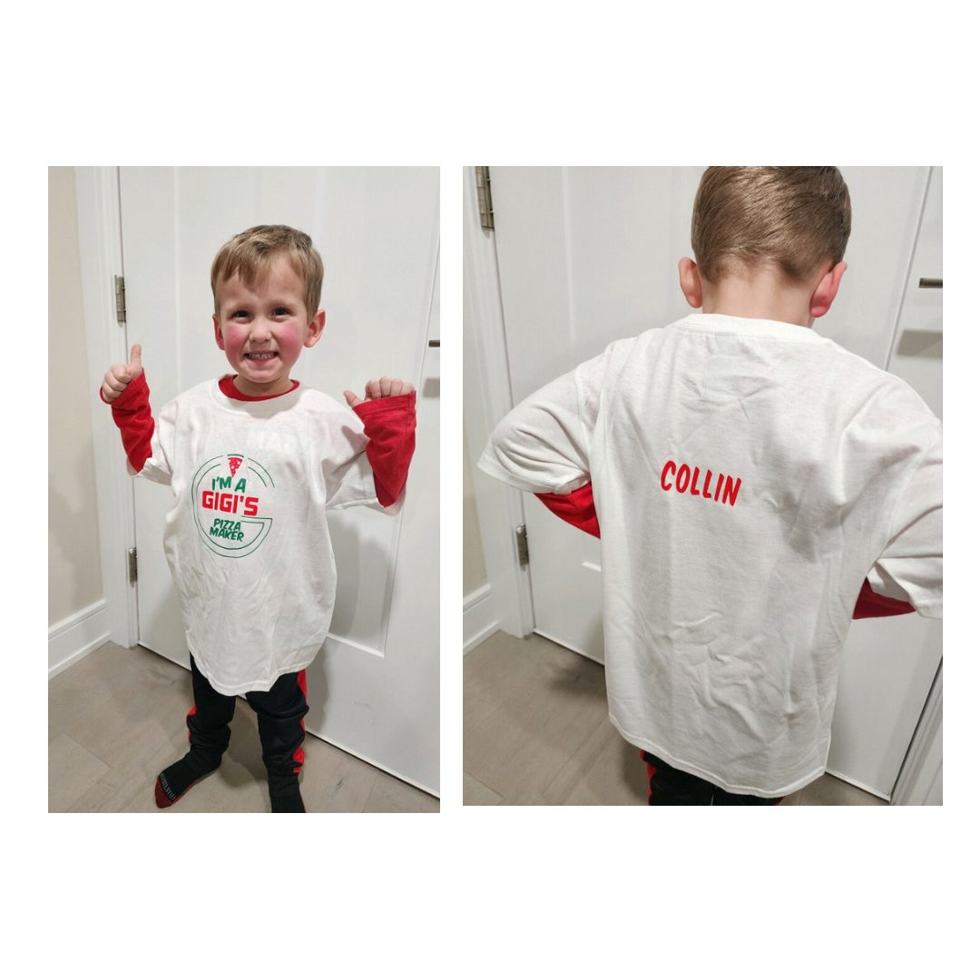 A young guest wearing a personalized I'm a Gigi's Pizza Maker t-shirt with their name printed on the back